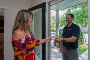 Smiling Restoration 1 expert speaking with home owner