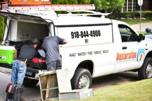 Restoration 1 work truck with employees